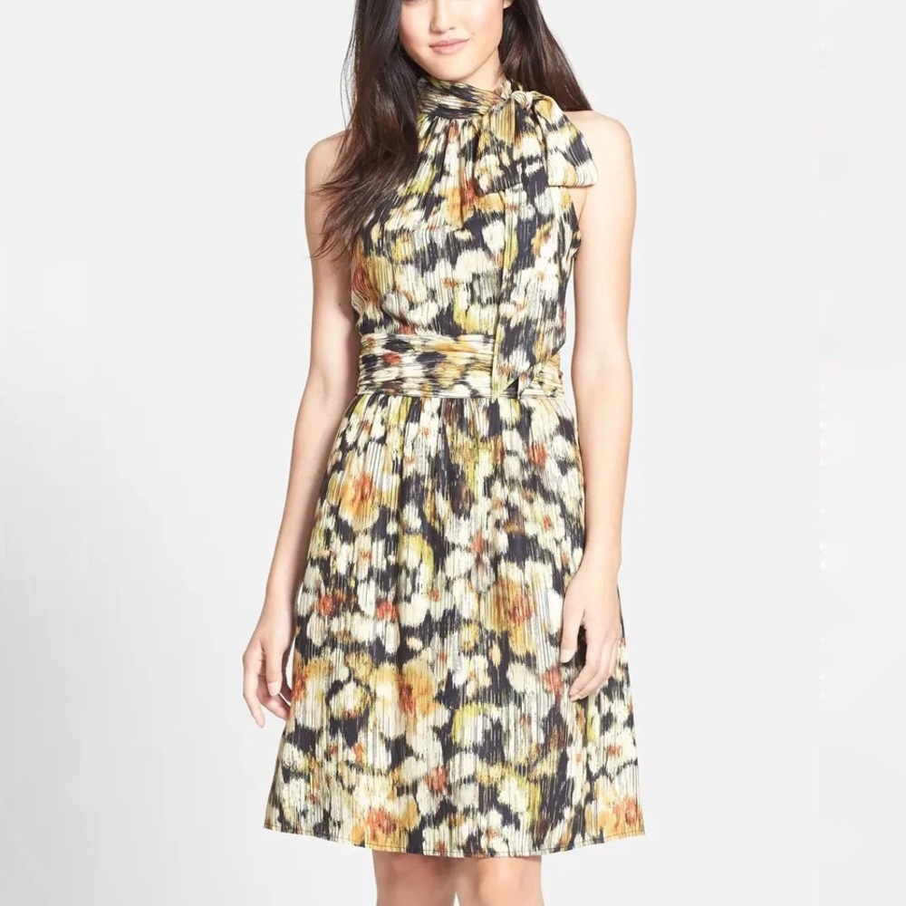 Fit and flare sleeveless dress with tie detail